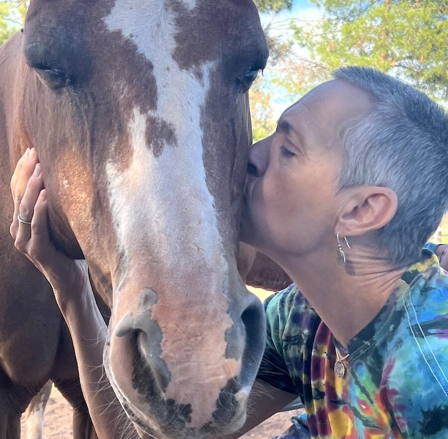 Sage Lewis sharing a sweet moment with a horse friend, Cody